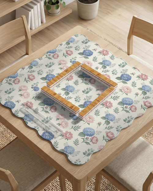 Pink floral mahjong table mat with peonies, blue hydrangeas, sage green leaves, and an ivory background.