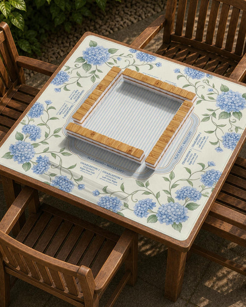 Blue hydrangea flowers and sage green leaves on a cream mahjong mat with a striped center and printed rule text around the border.