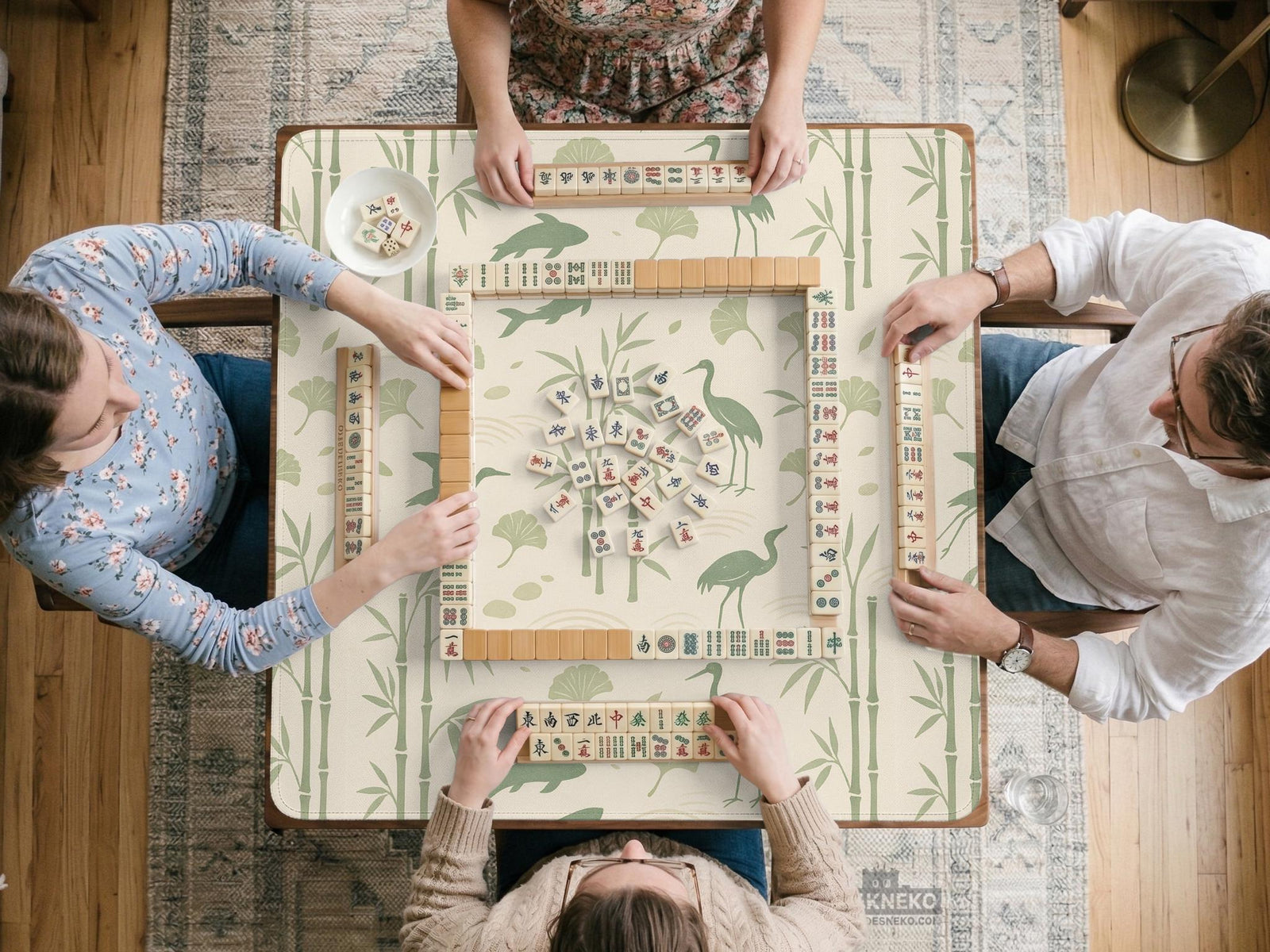 Green mahjong mat with a bamboo pattern, koi fish, crane birds, and ginkgo leaves in a nature-inspired design.