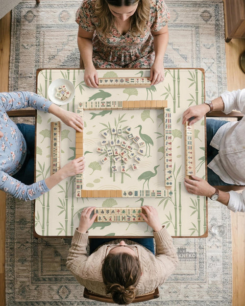 Green mahjong mat with a bamboo pattern, koi fish, crane birds, and ginkgo leaves in a nature-inspired design.