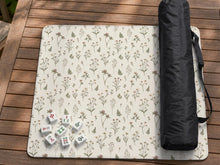 Cream square mahjong mat with a floral pattern of wildflower stems, sage leaves, and small blush blooms.