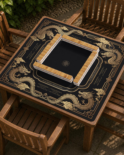 Black mahjong mat with gold dragon artwork, an Art Deco border, and printed Mahjong rules.