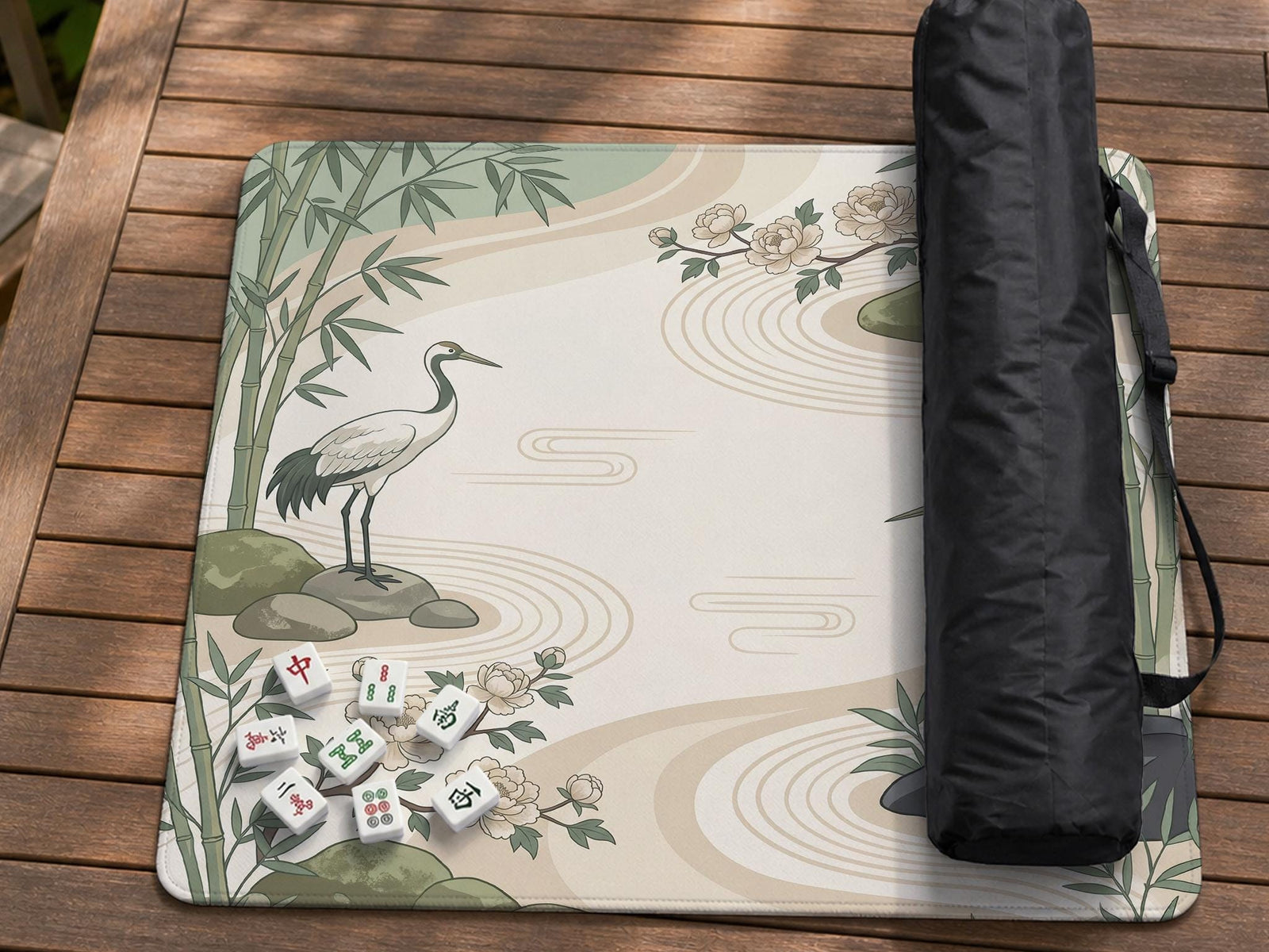 Square mahjong mat with a sage green crane and bamboo design on a cream background, with peony flowers and stone details.