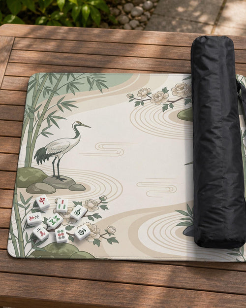 Square mahjong mat with a sage green crane and bamboo design on a cream background, with peony flowers and stone details.