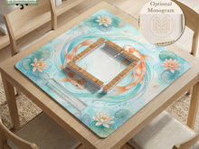 Aqua mahjong mat with orange koi fish, blue water, lotus flowers, water lilies, and lily pads.