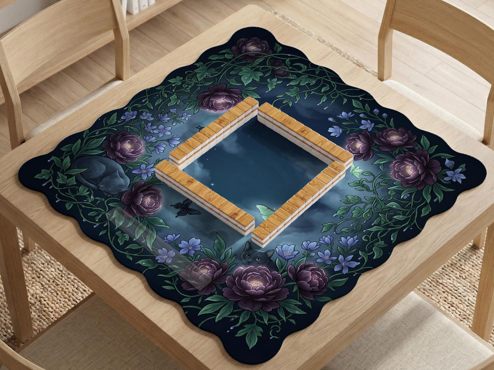 Purple mahjong mat with a botanical floral print, scalloped edge, oversized peonies, leafy vines, blue flowers, butterflies, and small cat details.