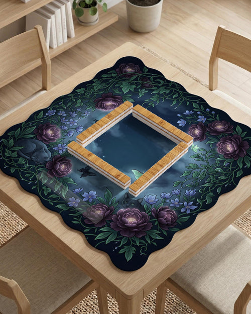 Purple mahjong mat with a botanical floral print, scalloped edge, oversized peonies, leafy vines, blue flowers, butterflies, and small cat details.