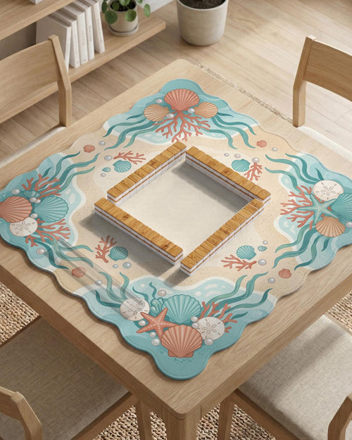 Pastel mahjong mat with a scalloped edge design featuring coral pink shells, aqua starfish, pearls, sand dollars, and a soft sea-inspired pattern.