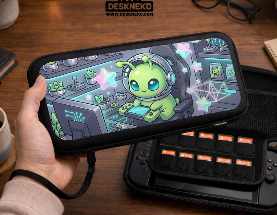 A Switch carrying case design with a cute green alien at a gaming desk, glowing cyan lights, and pastel stars on a dark background.