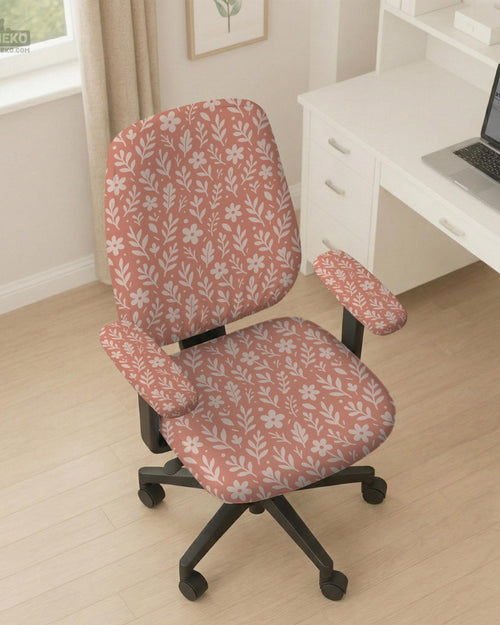Pink chair cover with a botanical floral print shown on an office chair, with matching armrest covers and multiple cover style options.