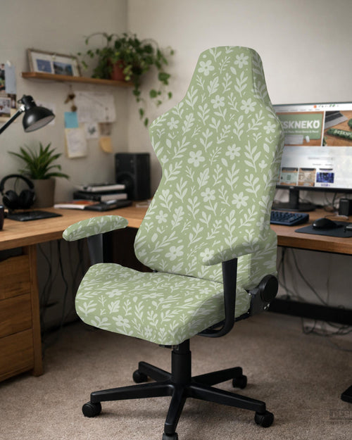 Green chair cover with a small botanical floral print in sage and cream.