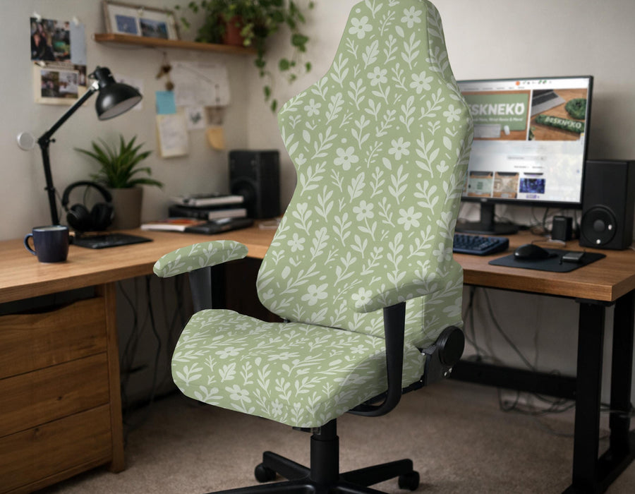 Green chair cover with a small botanical floral print in sage and cream.