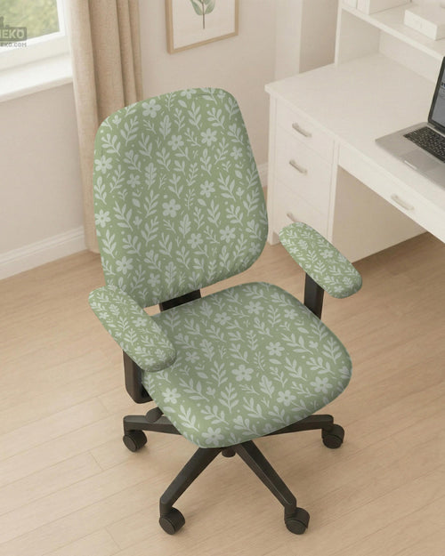 Sage green desk chair cover with a small floral and leaf print shown on an office chair.