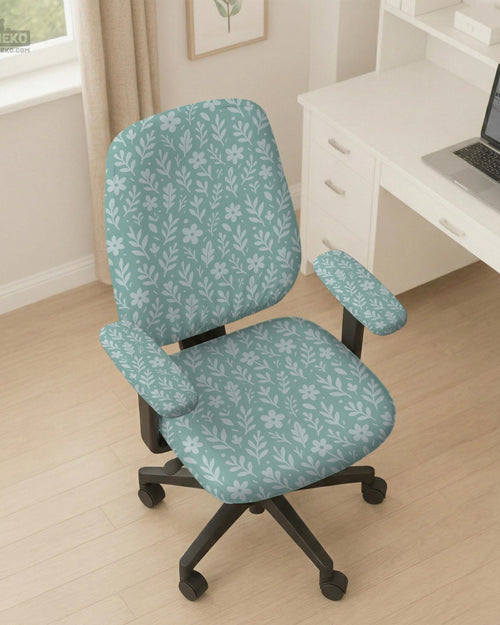Mint and white botanical desk chair cover with a floral leaf pattern shown on an office chair.