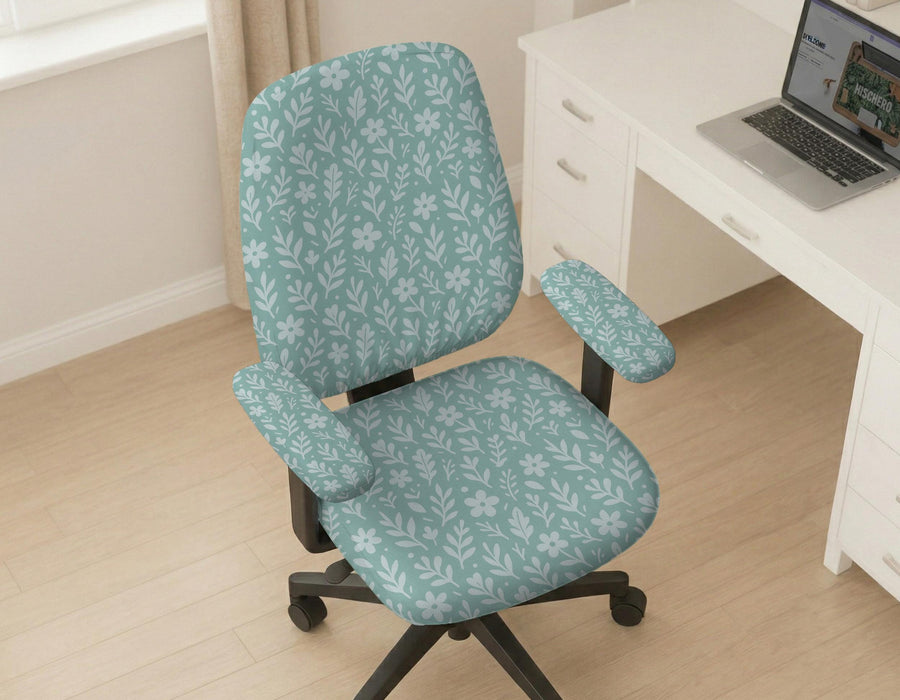 Mint and white botanical desk chair cover with a floral leaf pattern shown on an office chair.