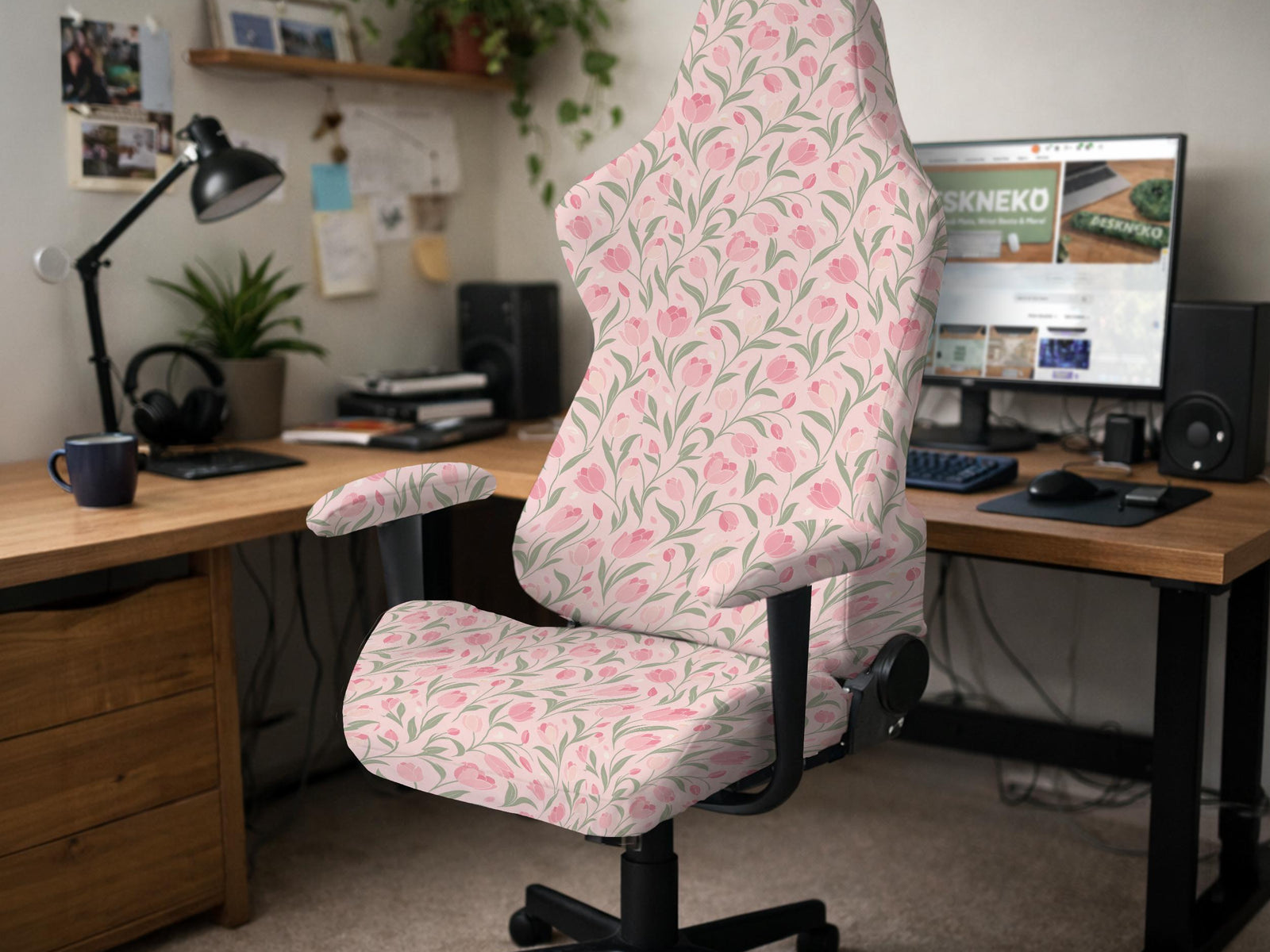 Pink floral stretch chair cover with a tulip pattern shown on a high-back gaming or office chair.