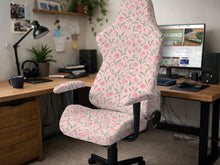 Pink floral stretch chair cover with a tulip pattern shown on a high-back gaming or office chair.