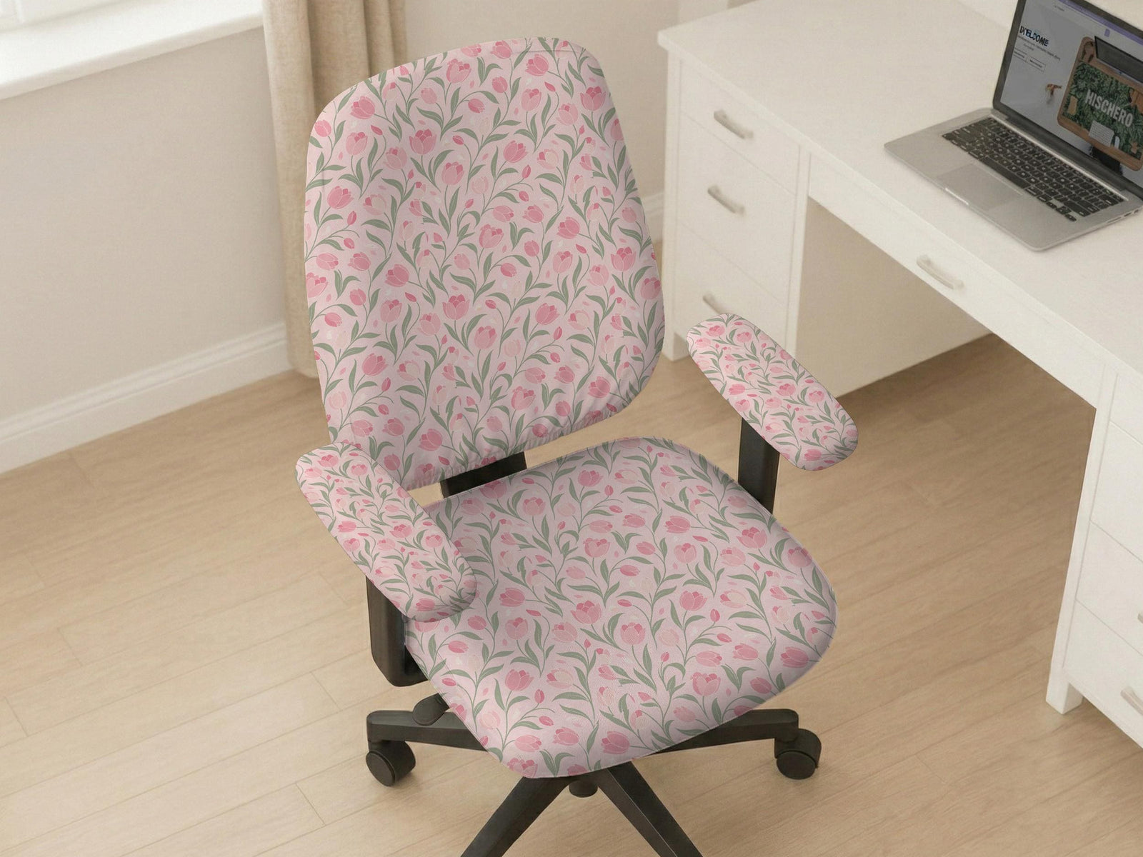 Pink chair cover with a tulip floral print shown as a desk chair slipcover, with armrest covers and size options.