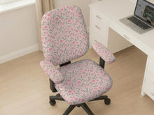 Pink chair cover with a tulip floral print shown as a desk chair slipcover, with armrest covers and size options.