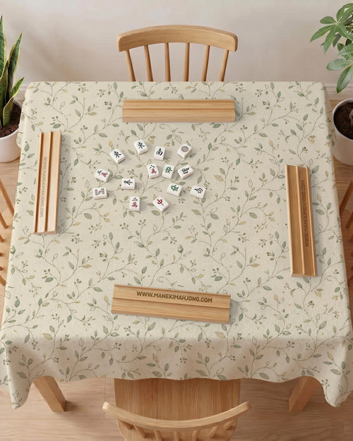 Sage green mahjong mat with vine and botanical artwork in cream neutral tones, shown in a cottagecore style with a tablecloth-style format.