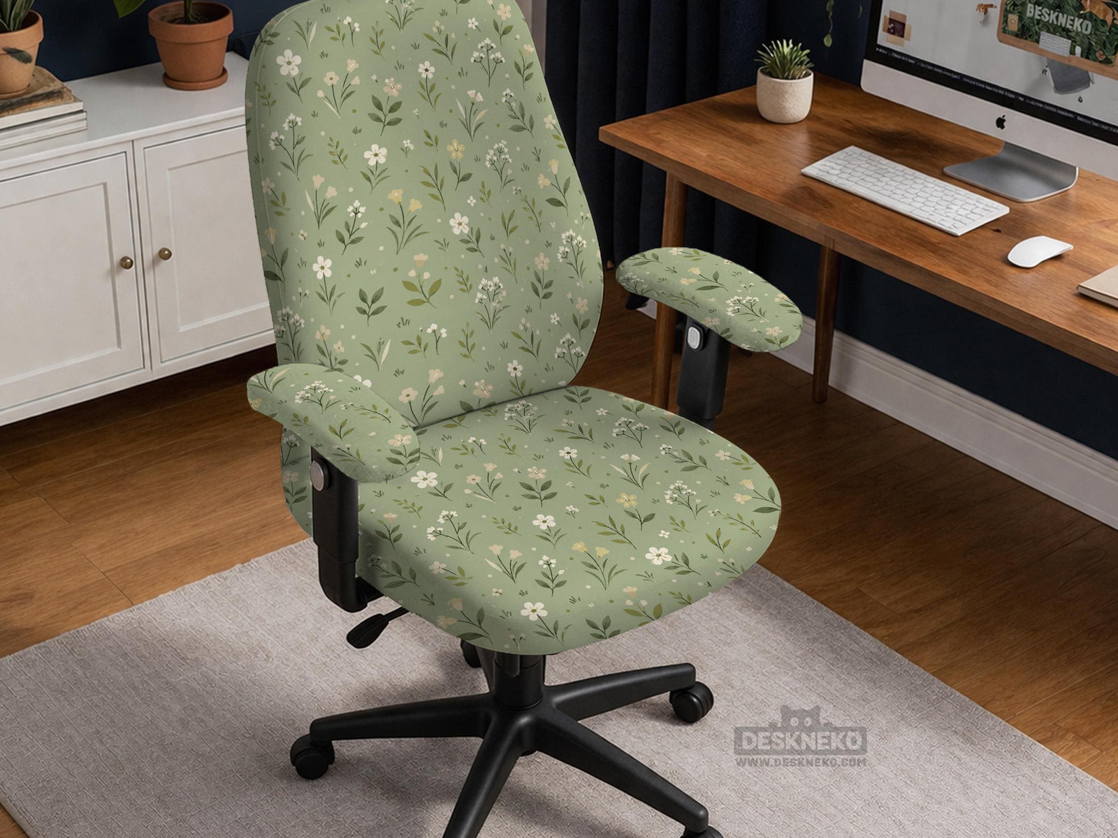 Sage green chair cover with a small floral print shown on a desk chair with a high back.
