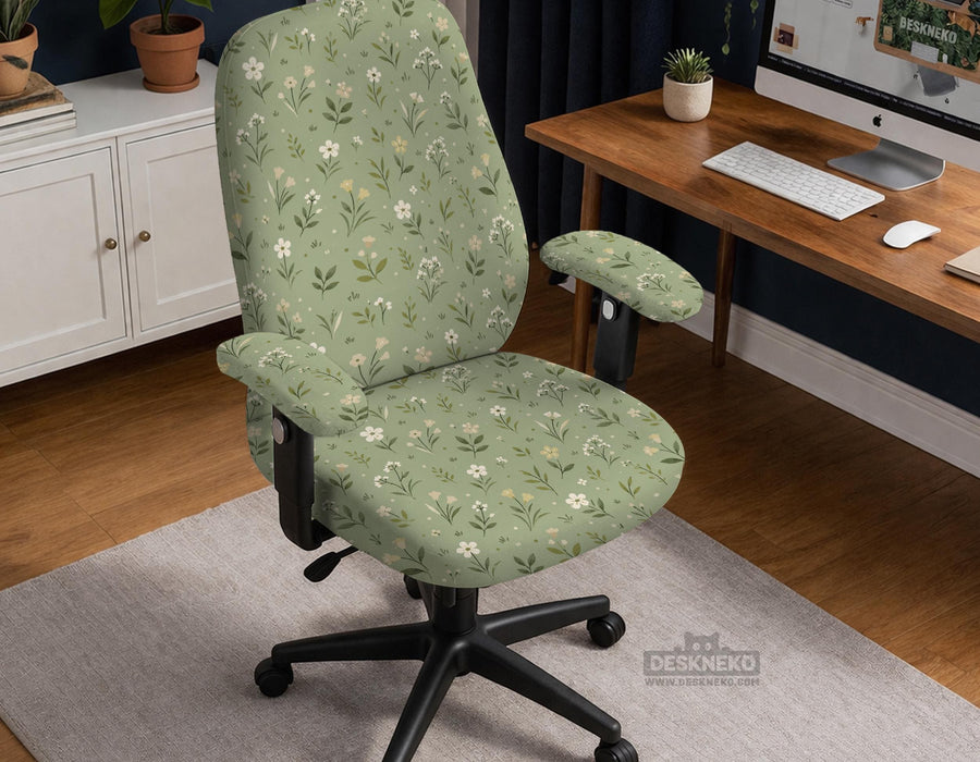 Sage green chair cover with a small floral print shown on a desk chair with a high back.