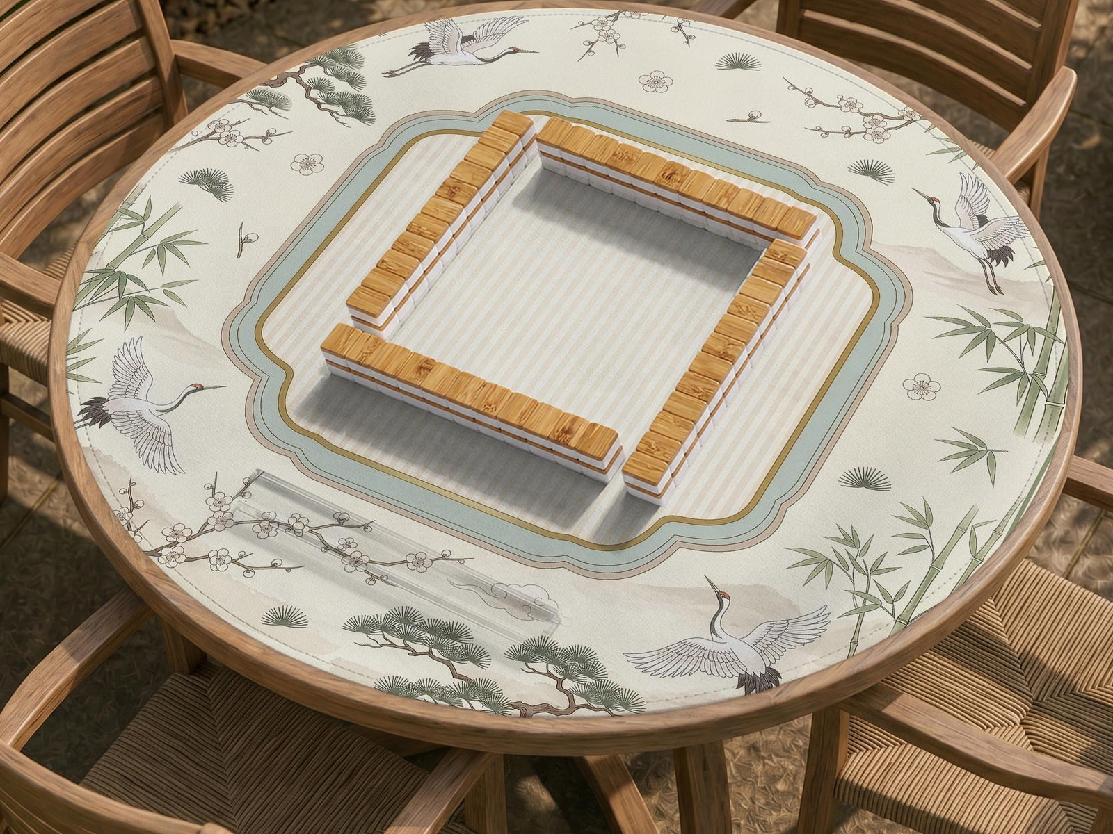 Square ivory mahjong mat with crane and bamboo pattern, a striped center, light blue border, and thin gold trim.