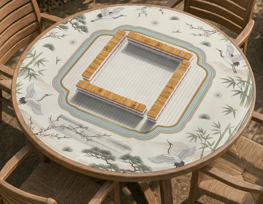 Square ivory mahjong mat with crane and bamboo pattern, a striped center, light blue border, and thin gold trim.