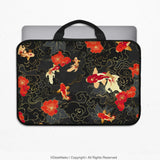 Padded koi fish laptop sleeve with black carry handles, printed with red, white and gold koi and red blossoms on a black and gold pattern, holding a laptop