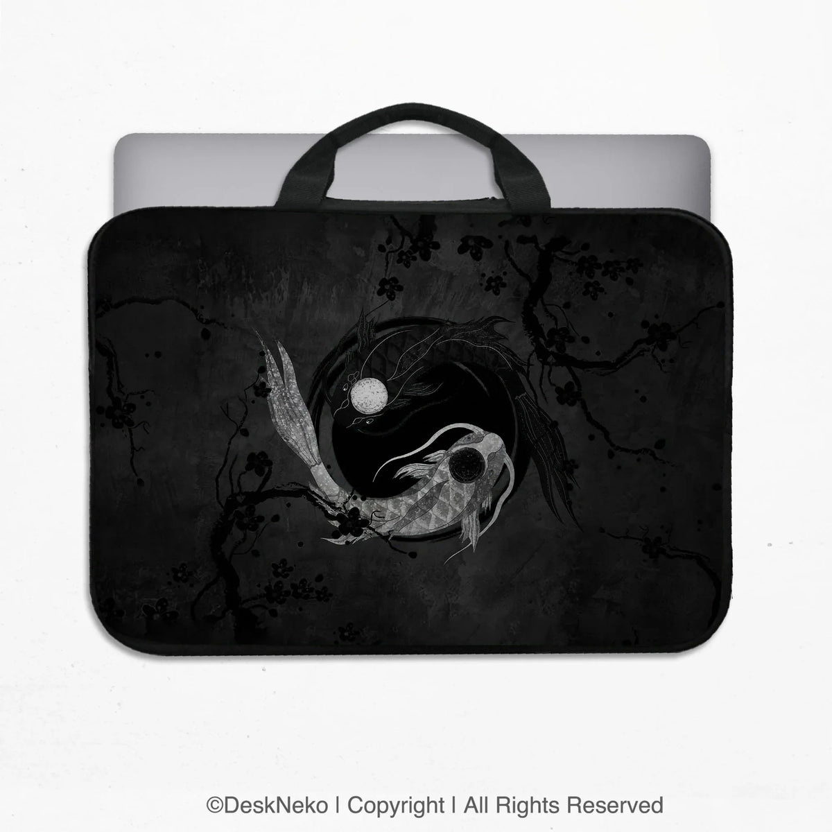 Padded laptop sleeve with carry handles printed with a dark yin-yang koi design of silver and black koi fish circling a moon among ink plum branches, holding a laptop