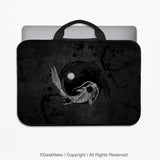 Padded laptop sleeve with carry handles printed with a dark yin-yang koi design of silver and black koi fish circling a moon among ink plum branches, holding a laptop