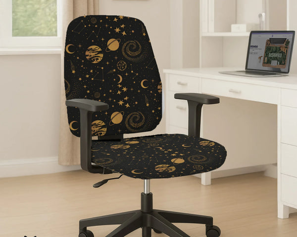 Office chair fitted with a black stretch cover printed with gold stars, moons, planets and constellations, shown in a home office