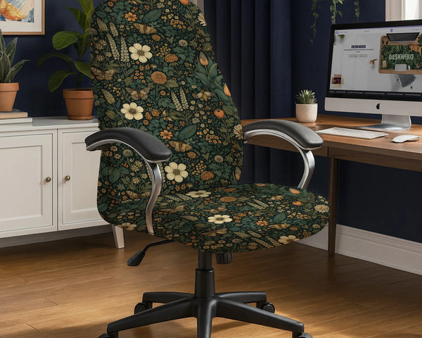 Office chair fitted with a stretch cover in a dark green botanical print with cream and orange wildflowers, butterflies and a bee, shown in a home office