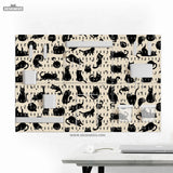 Pegboard wall organizer set printed with playful black cat silhouettes and paw prints on a cream background, fitted with white shelves, cups and hooks