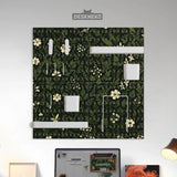 Botanical pegboard organizer with dark green floral pattern