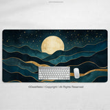 Moonrise desk mat printed with a large gold moon over layered teal and gold mountain waves and a gold-flecked starry sky, shown with a keyboard and mouse