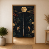 Black Gold Koi Moon noren curtain in a warm doorway, showing two broad split panels with koi pond artwork.