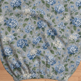 Blue Hydrangea Drift fabric and elastic detail; selected cover option only, chair not included.