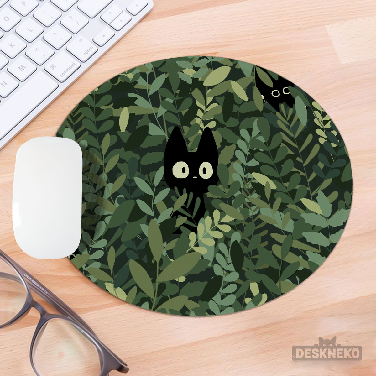 Cats in the Bushes mousepad on a wooden desk