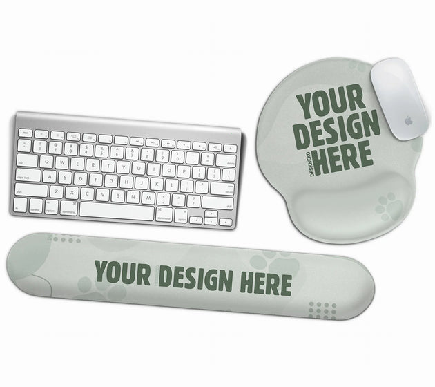 Custom ergonomic set with a round gel mouse pad and a keyboard wrist rest, shown as blank sage-green personalizable templates with a 'your design here' placeholder beside a keyboard and mouse