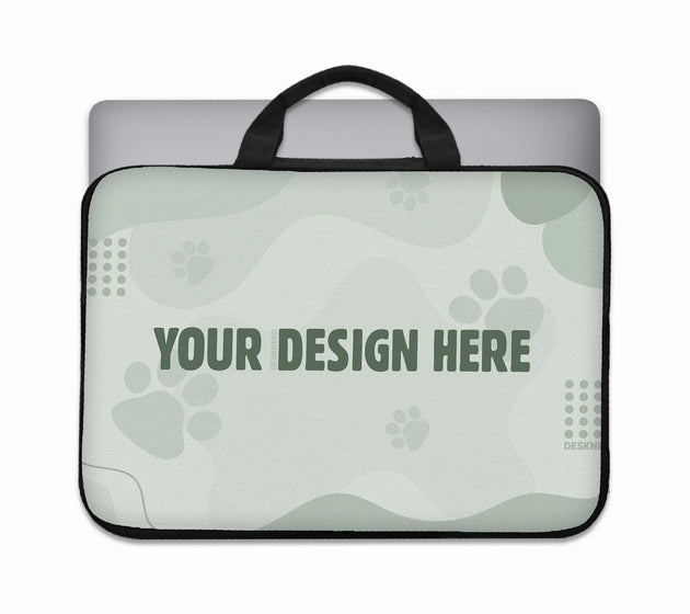 Custom laptop sleeve with carry handles and a laptop inside, shown as a blank sage-green personalizable template with a 'your design here' placeholder