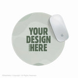 Custom round mousepad shown as a blank sage-green personalizable template with a 'your design here' placeholder, next to a white mouse