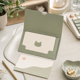 DeskNeko gift card in a soft sage desk setup