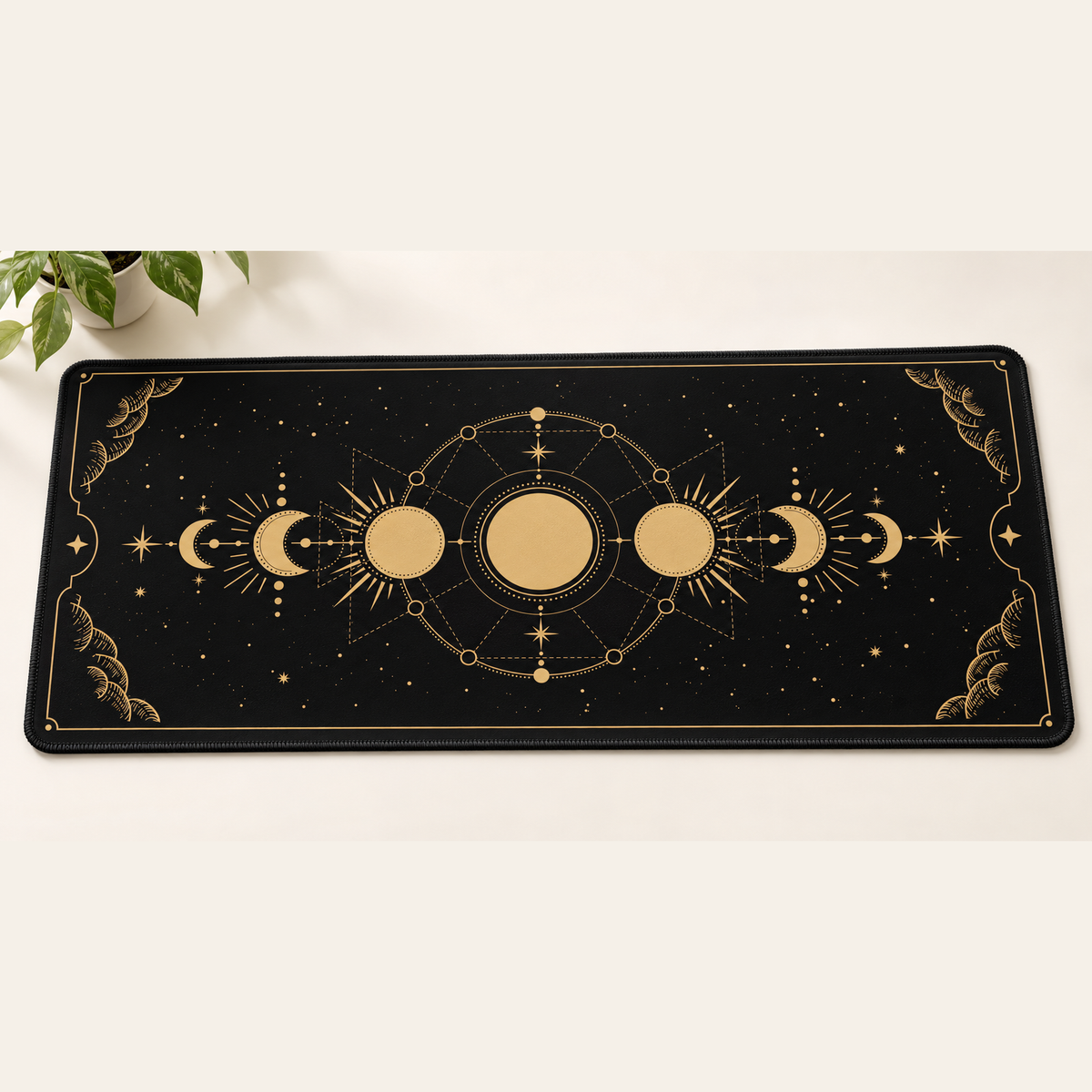 Moon Phases desk mat with black stitched edges