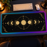 Moon Phases RGB-LED desk mat in an evening gaming setup
