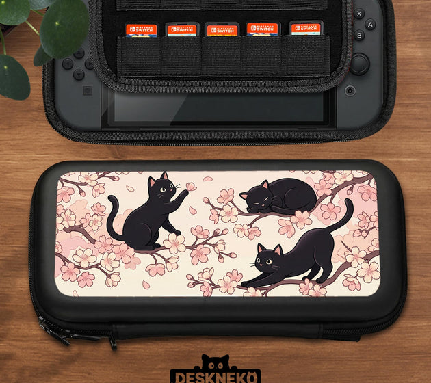 Switch case with black cats and cherry blossoms on a light pastel background.