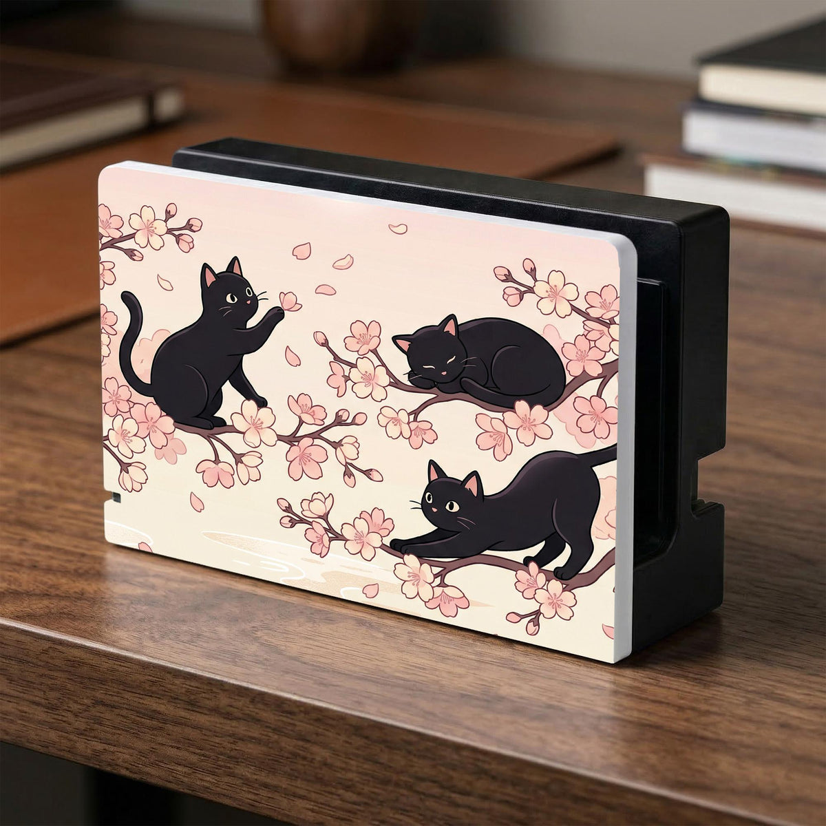 Switch case with black cats and cherry blossoms on a light pastel background.