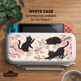 Switch case with black cats and cherry blossoms on a light pastel background.