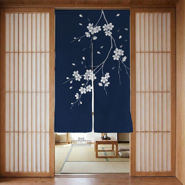 Navy door curtain with pink cherry blossom branches and a light floral layout on a dark background.