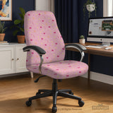 Pink chair cover with a pattern of moons, stars, bows, and small decorative shapes on a chair with armrests.